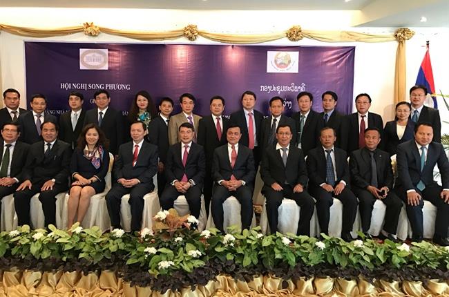 Chủ tịch HĐQT Vietcombank tháp tùng Thống đốc tham dự Hội nghị song phương lần thứ 6 giữa NHNN VN và NHCHDCND Lào